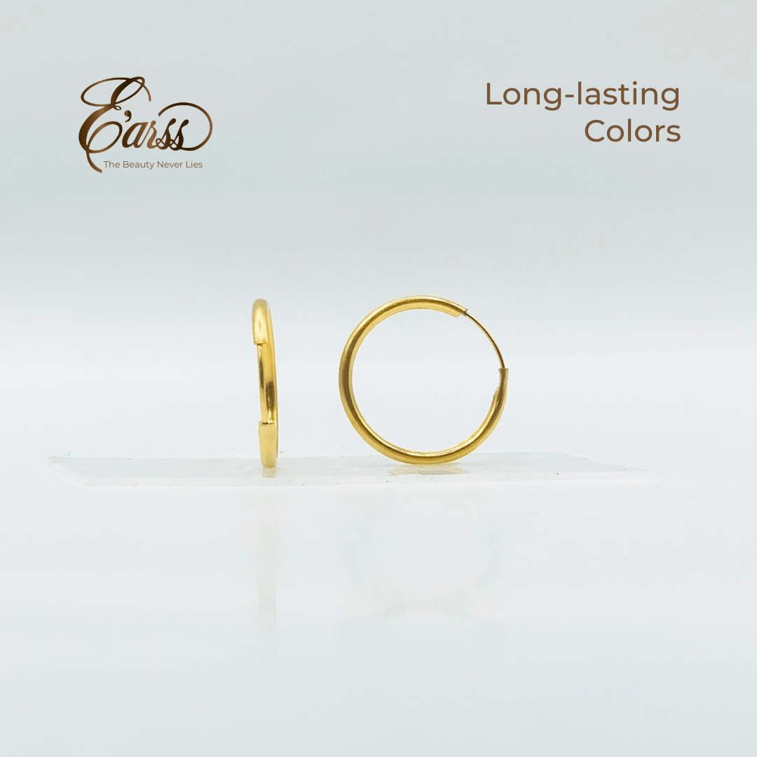 Gold hoop earrings on a light gray background with 'Eauss' branding.