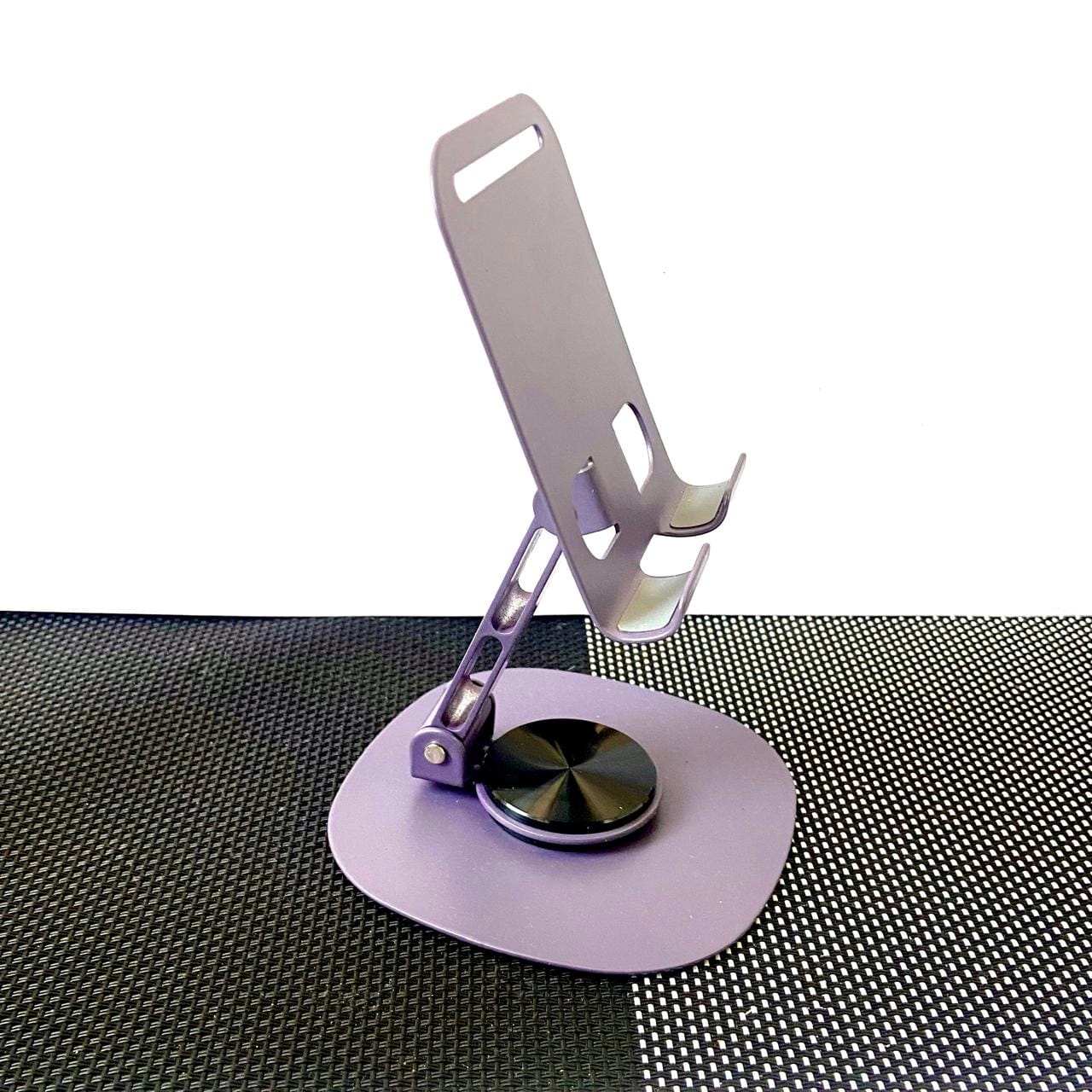 Phone holder with a suction cup on a textured surface