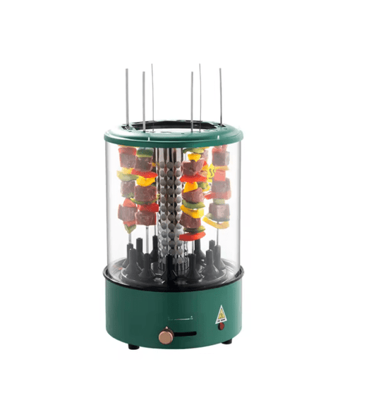 Green electric skewer grill with skewers of colorful food on a white background