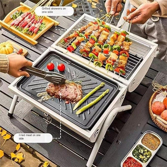 Portable grill with skewers and meat on a wooden table