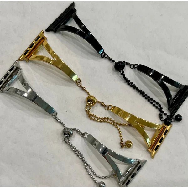 Metallic chain accessories on a light gray background