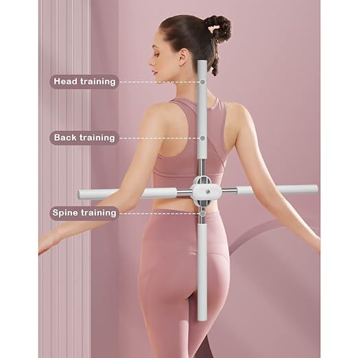 Woman using a fitness tool for back and spine training on a pink background