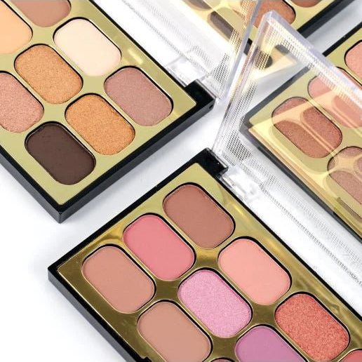 Makeup palettes with various shades of eyeshadows and blushes on a white background