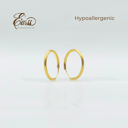 Gold hoop earrings on a light gray background with 'Earss' brand name and 'Hypoallergenic' text.