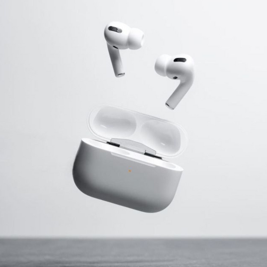 Wireless earbuds with charging case on a light gray background