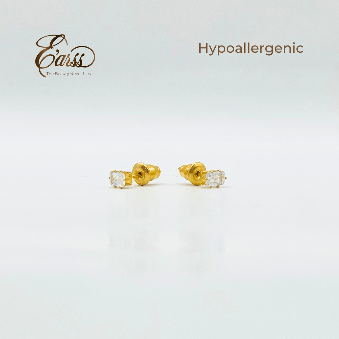 Gold earrings with clear stones on a light gray background, featuring the brand 'Ears'.