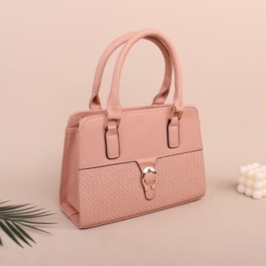 Pink handbag with a gold lock on a beige background