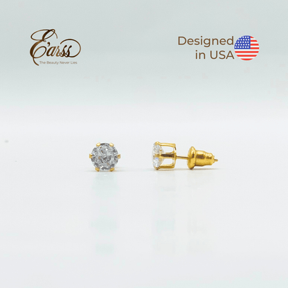 Gold stud earrings with clear gemstones on a light gray background, featuring the 'Earss' brand and 'Designed in USA' text.