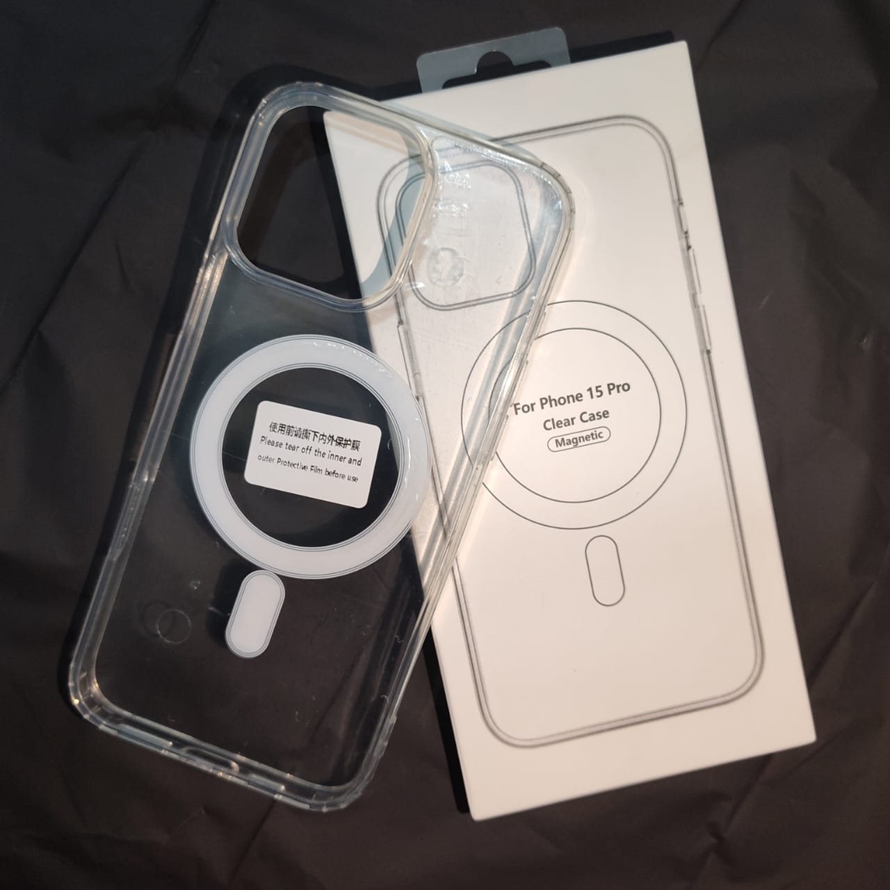 Clear phone case with ring holder on a black background