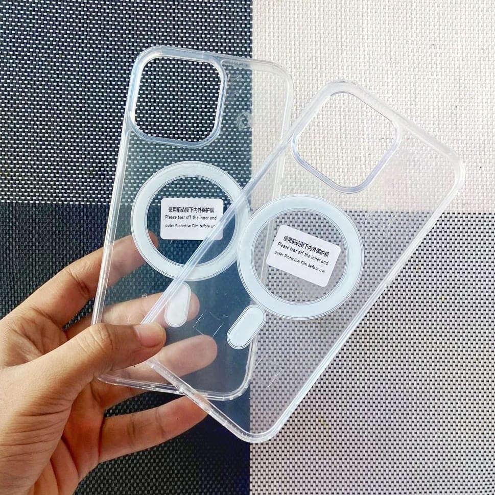 Clear phone case with cutouts for camera and flash held by a hand on a textured background