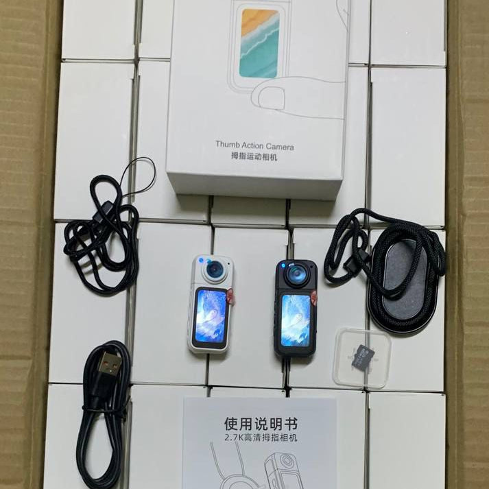 Product packaging with two devices, a box, and a user manual on a white background.