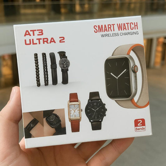Smart watch packaging with 'AT3 Ultra 2' branding held by a hand in an indoor setting.