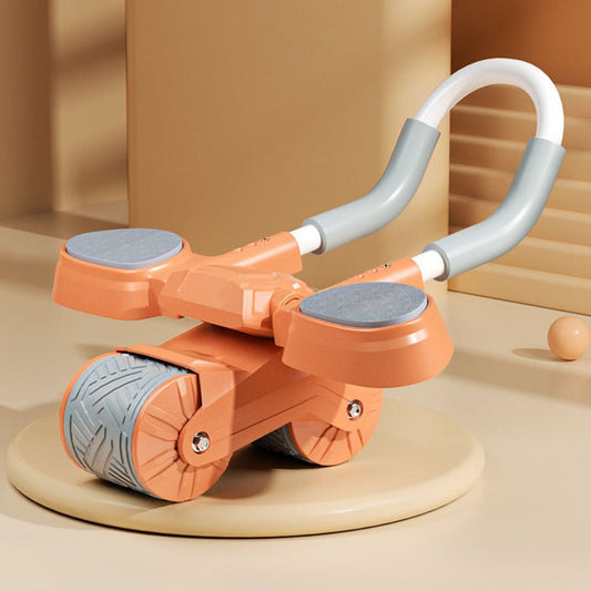 Toy scooter with orange body and gray wheels on a beige platform