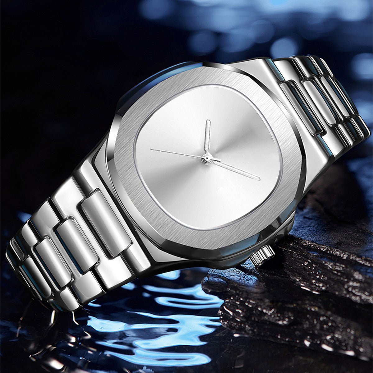 Silver watch with a reflective surface on a dark background