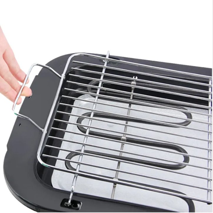 Portable electric grill with a metal grid on a white background