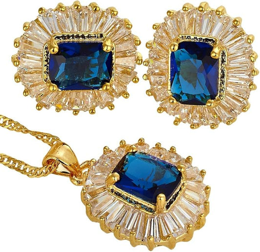 Jewelry set with blue gemstones and gold accents on a white background