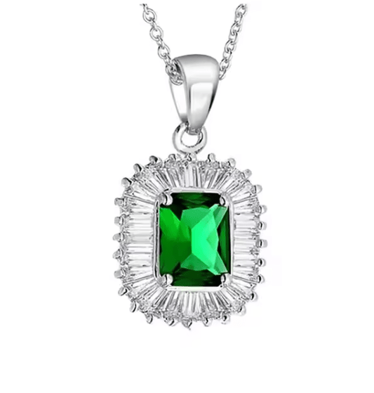 Silver necklace with a green gemstone pendant on a white background
