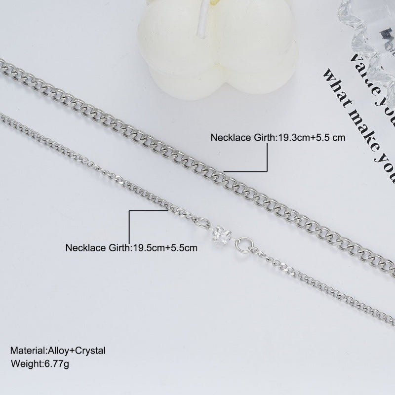 Silver necklace with measurements and material details on a white background