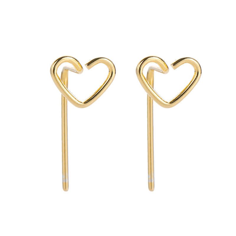 Gold heart-shaped earrings on a white background