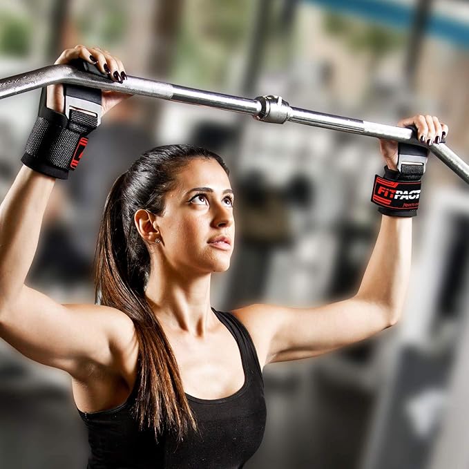 Woman exercising with a barbell in a gym setting