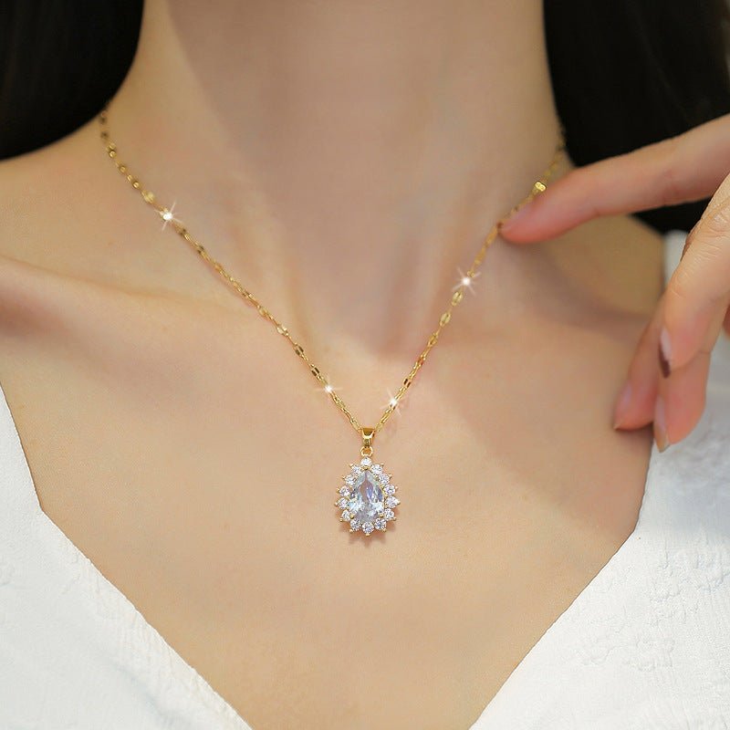 Gold necklace with a diamond pendant on a mannequin