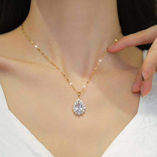 Gold necklace with a diamond pendant on a mannequin