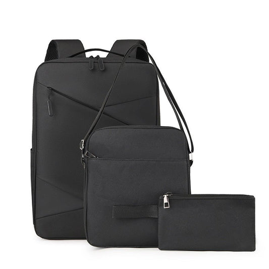 Set of black backpack, crossbody bag, and pouch on a white background