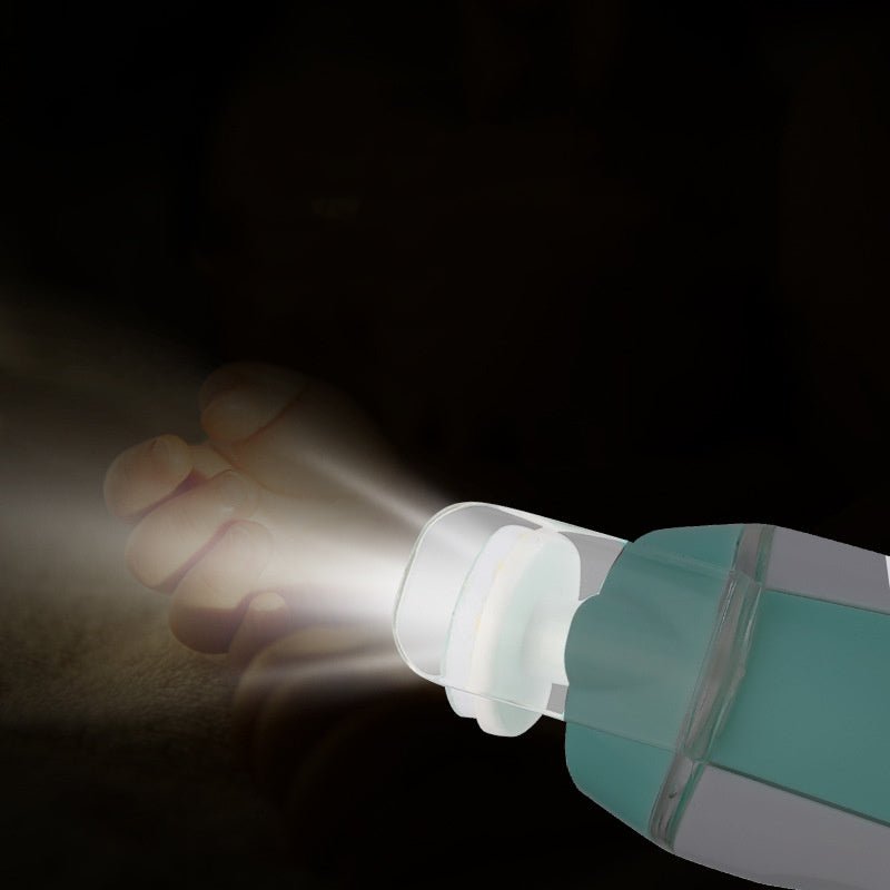 Hand holding a flashlight against a dark background