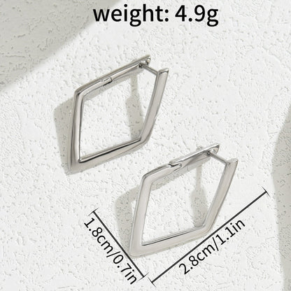Pair of silver geometric hoop earrings on a textured white surface with weight and dimensions displayed.