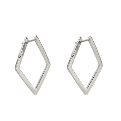 Pair of silver hoop earrings on a white background