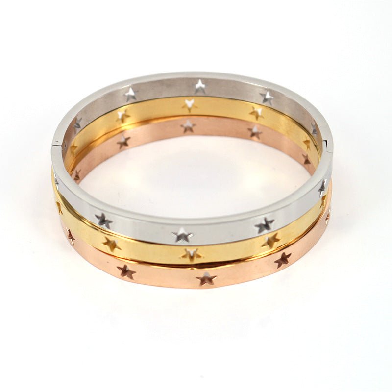 Three gold rings stacked on a white background
