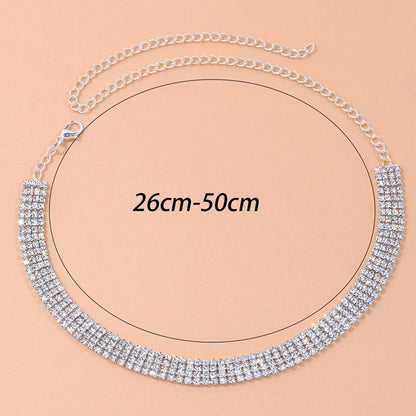 Silver necklace with adjustable chain length on a beige background