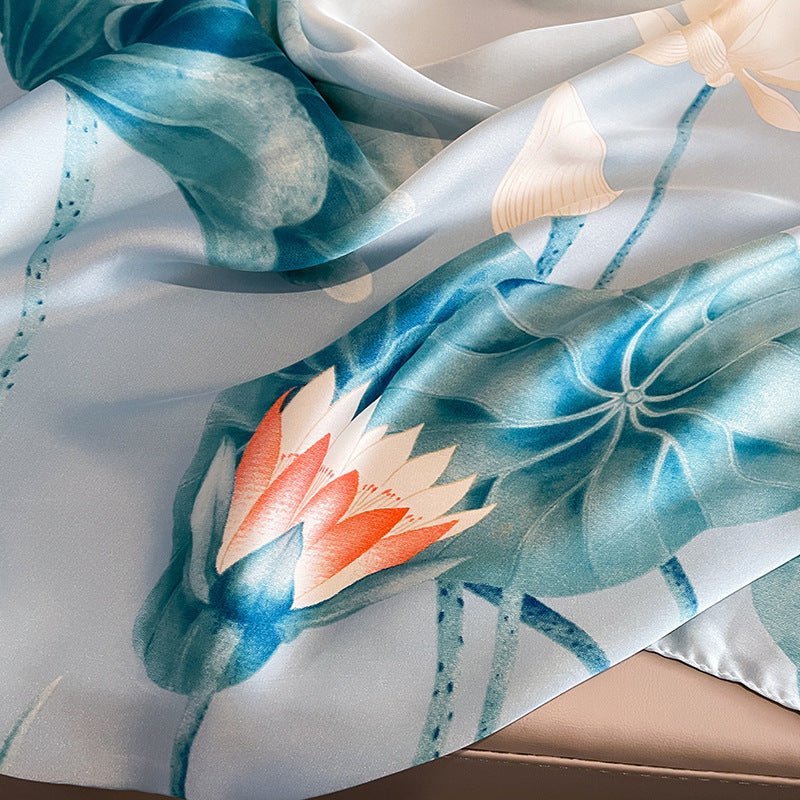 Silk scarf with floral design on a neutral background