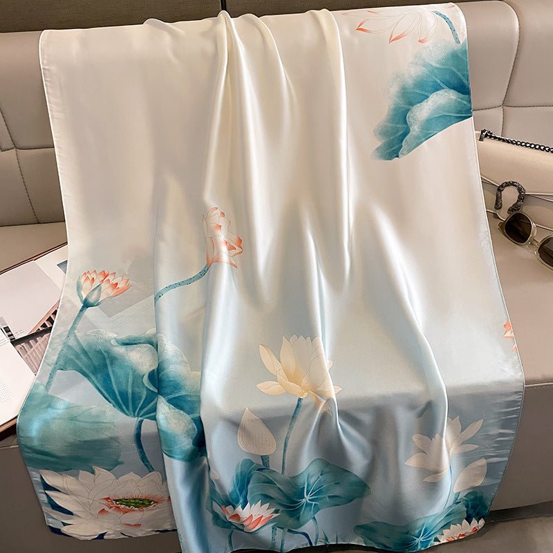 Decorative blanket with floral design draped over a couch