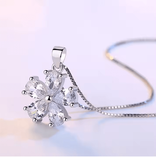 Silver necklace with a butterfly-shaped pendant on a light background